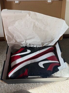 Jordan 1 Low Nike Men’s Black and Red Low-Top Sneakers with White Swoosh